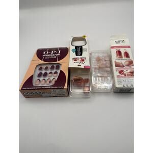 3 boxes of press on nails. One full new set and two incomplete sets